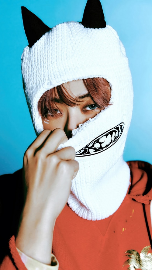 NCT DREAM's Jaemin wearing a white balaclava with cat ears