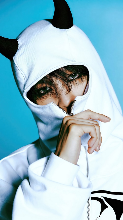 NCT DREAM Haechan wearing a white hoodie with horns