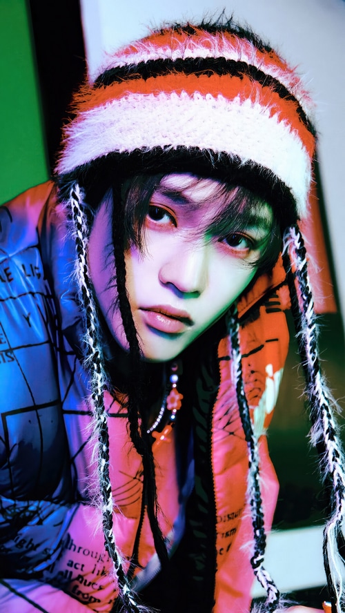 Chenle from NCT DREAM wearing a striped beanie