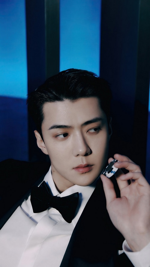 Sehun of EXO holding a poker chip