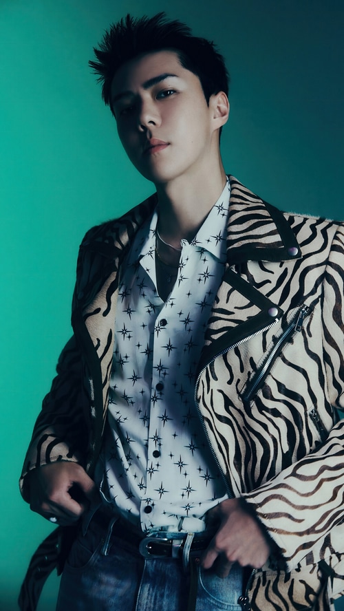 Sehun wearing a zebra print jacket and star patterned shirt