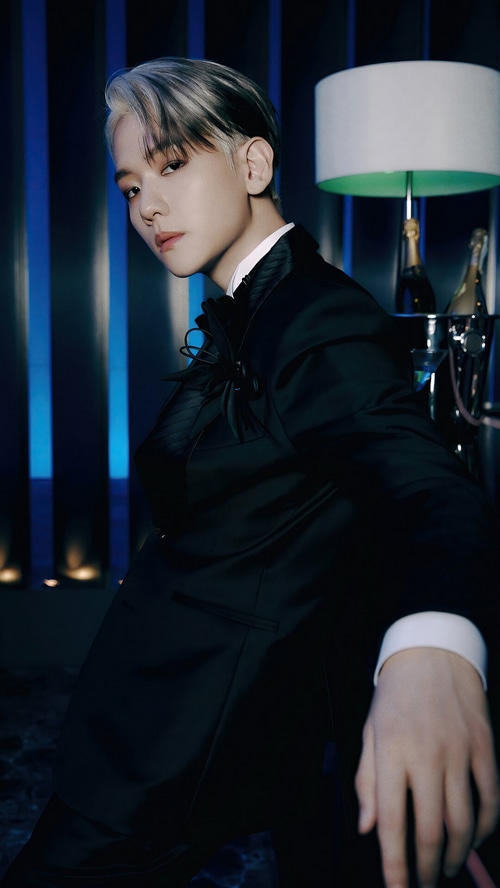 Baekhyun in a black suit with a white shirt