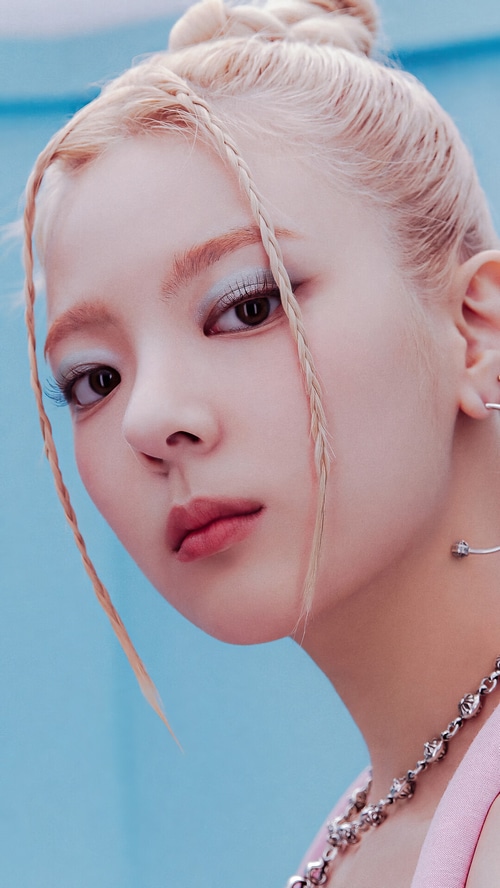 Lia from ITZY with blonde braided hair