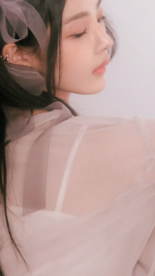 Minji from NewJeans in a sheer top