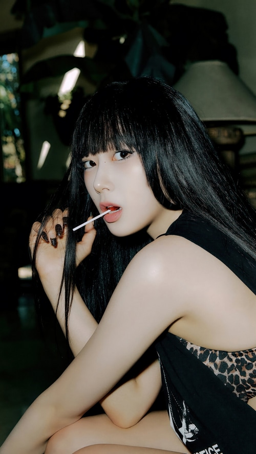 Giselle of Aespa with a lollipop