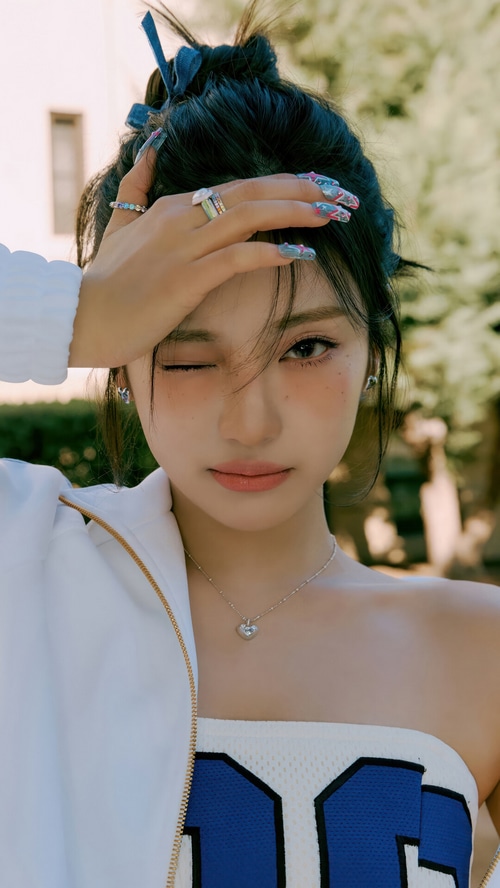 Ningning from Aespa winks with hand on forehead