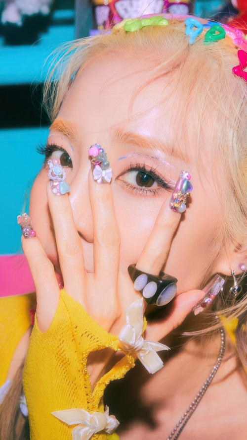 Sandara Park with colorful nails and hair accessories