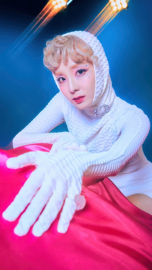 Sandara Park in a white hooded outfit with pink accents