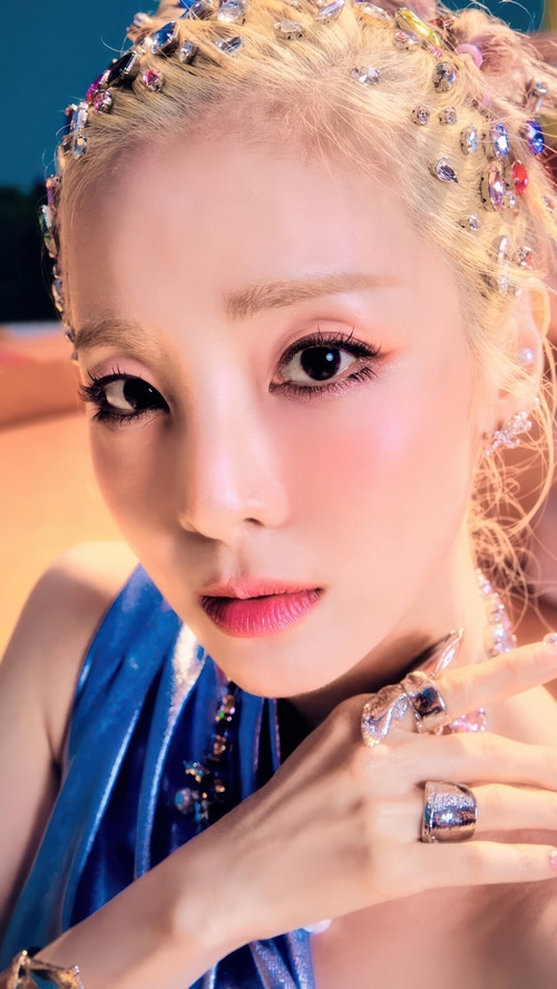 Sandara Park with colorful hair gems and blue dress