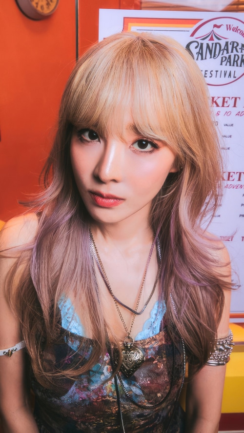 Sandara Park in a colorful outfit with necklaces