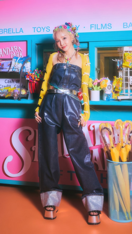 Sandara Park in a denim jumpsuit with yellow cardigan