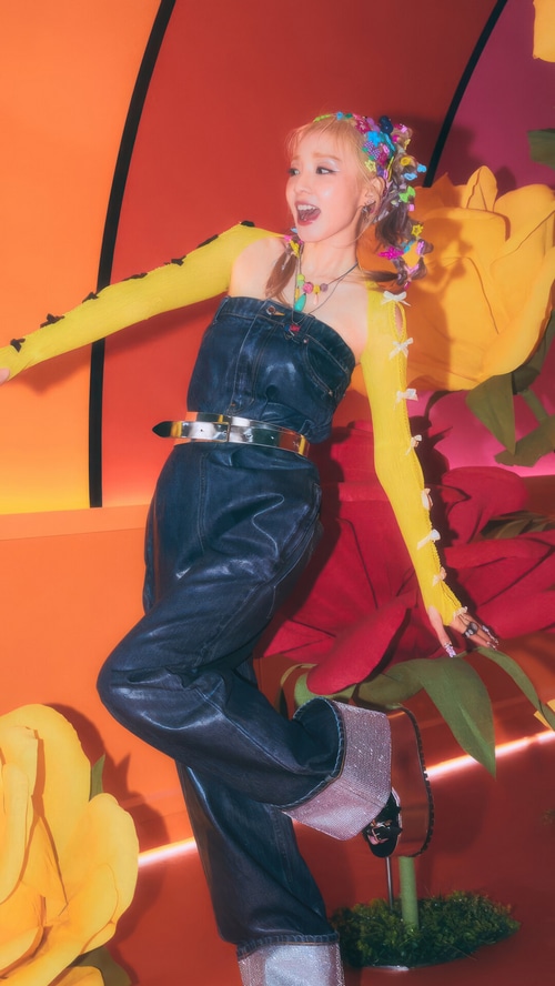 Sandara Park in a denim jumpsuit with yellow sleeves