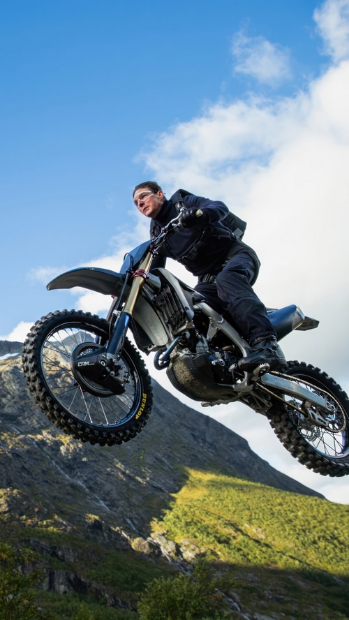 Tom Cruise performs a motorcycle stunt in Mission: Impossible