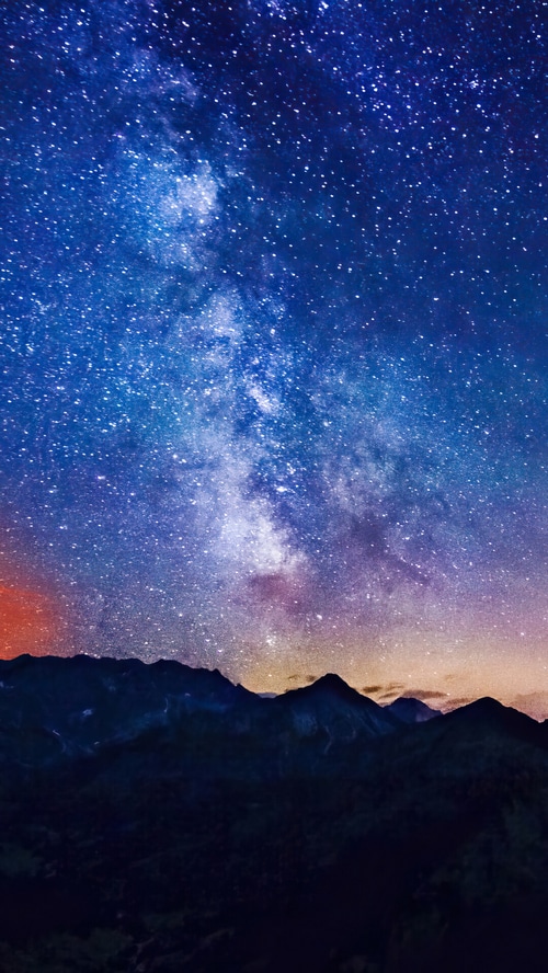 Night sky with the Milky Way over mountains