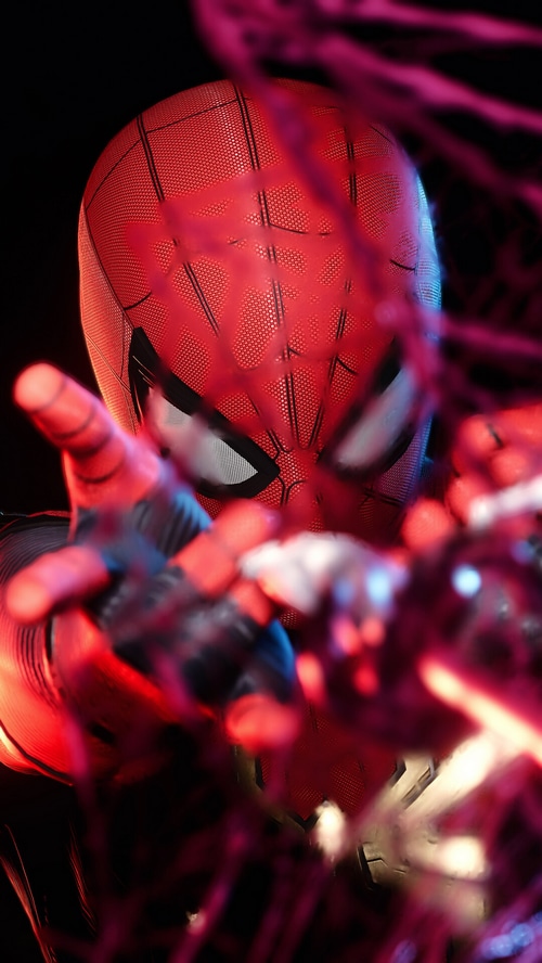 Marvel's Spider-Man reaching out through pink webs