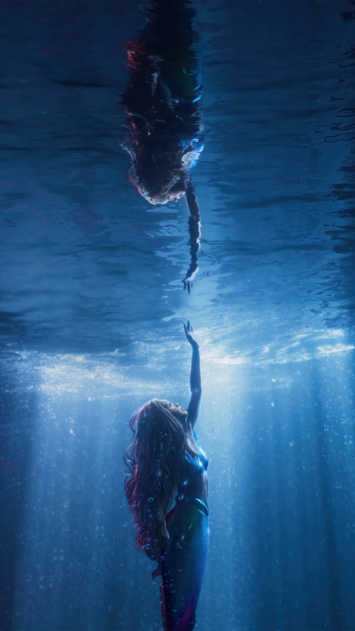 Ariel reaching for her reflection in The Little Mermaid