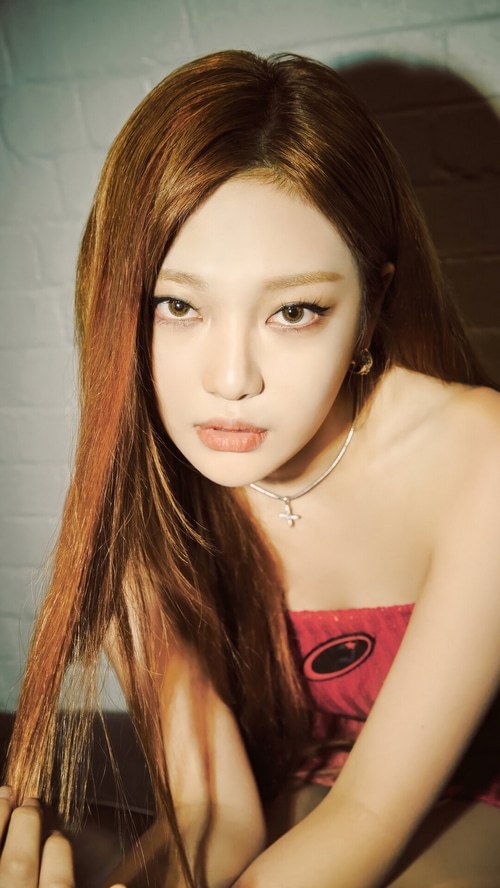 Ningning from Aespa in a red tube top