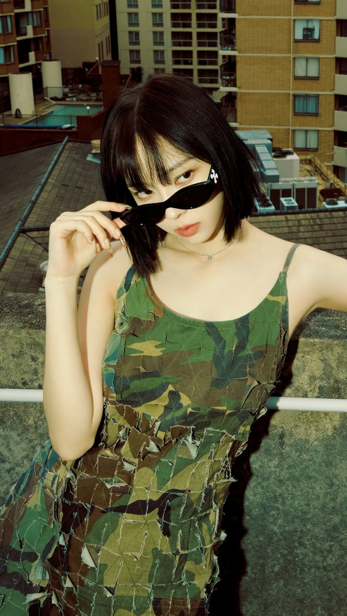 Aespa Karina in a camouflage dress on a rooftop