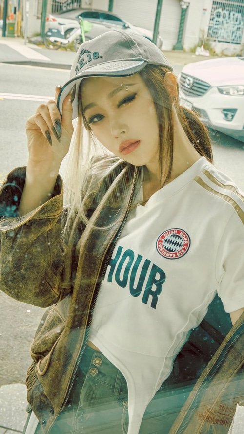 Giselle wearing a cap and jacket