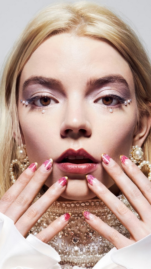 Anya Taylor-Joy with dramatic makeup and nails