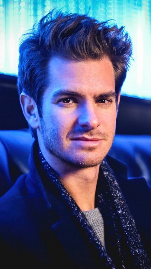 Andrew Garfield in a blue-lit setting