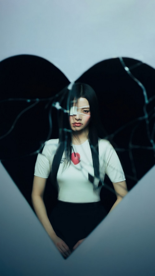 Huh Yunjin of LE SSERAFIM with a bandaged eye