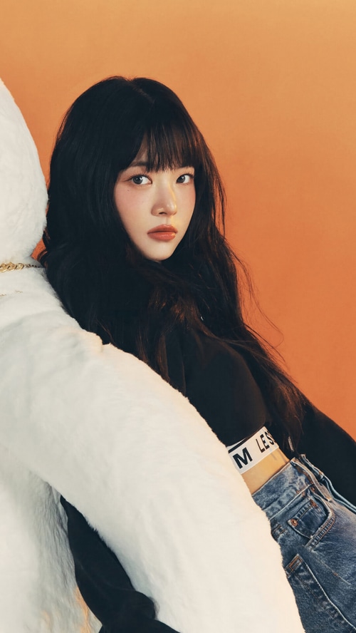 Hong Eunchae of LE SSERAFIM with a large white plush toy