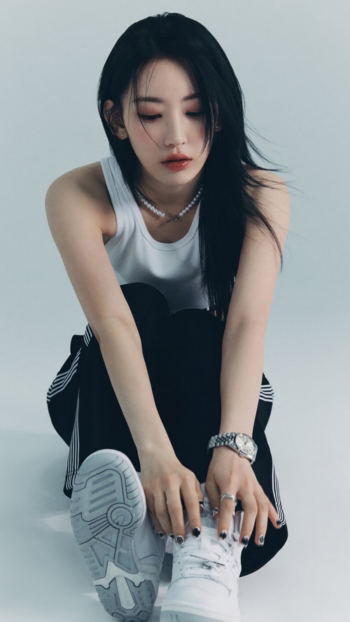 Miyawaki Sakura of LE SSERAFIM in white tank top and black pants