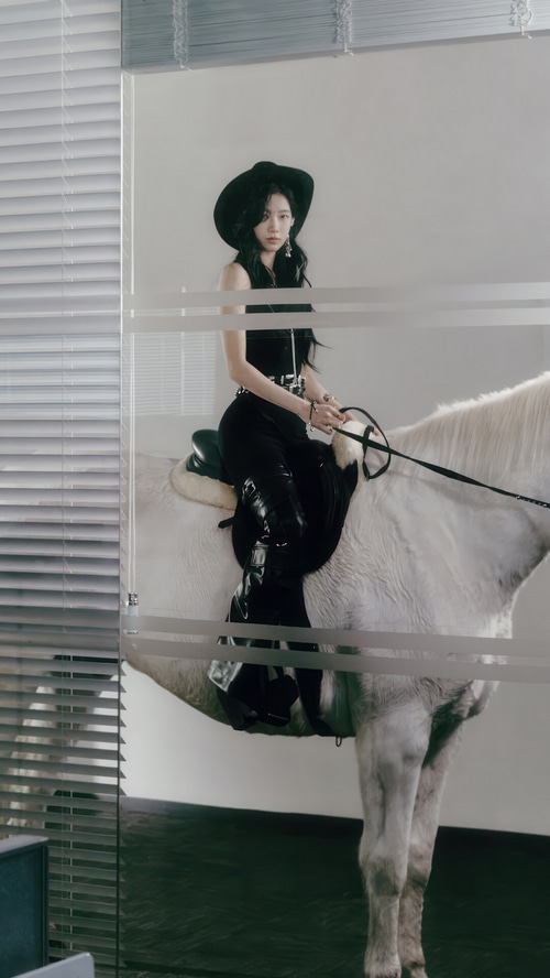 Kazuha of LE SSERAFIM on a white horse