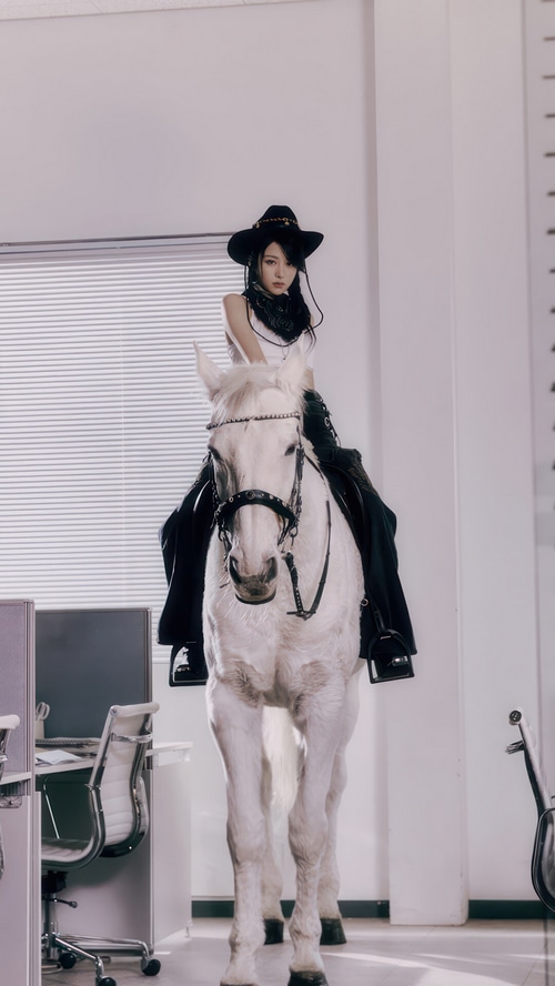Huh Yunjin of LE SSERAFIM on a white horse