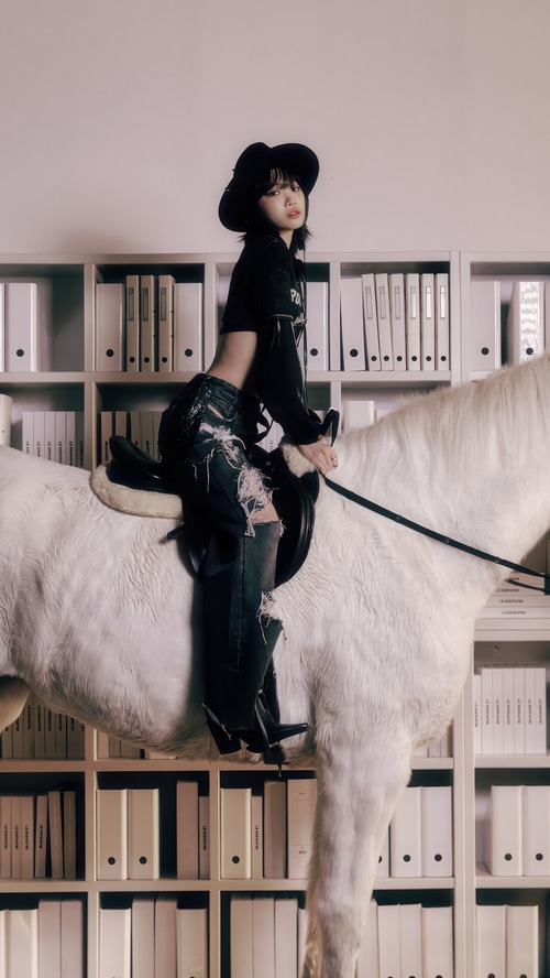 Kim Chae-won of LE SSERAFIM on a white horse