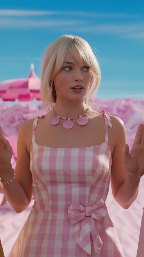Margot Robbie as Barbie in a pink gingham dress