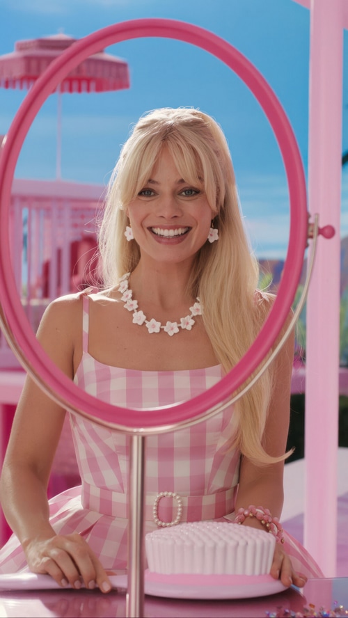 Margot Robbie as Barbie in pink gingham dress