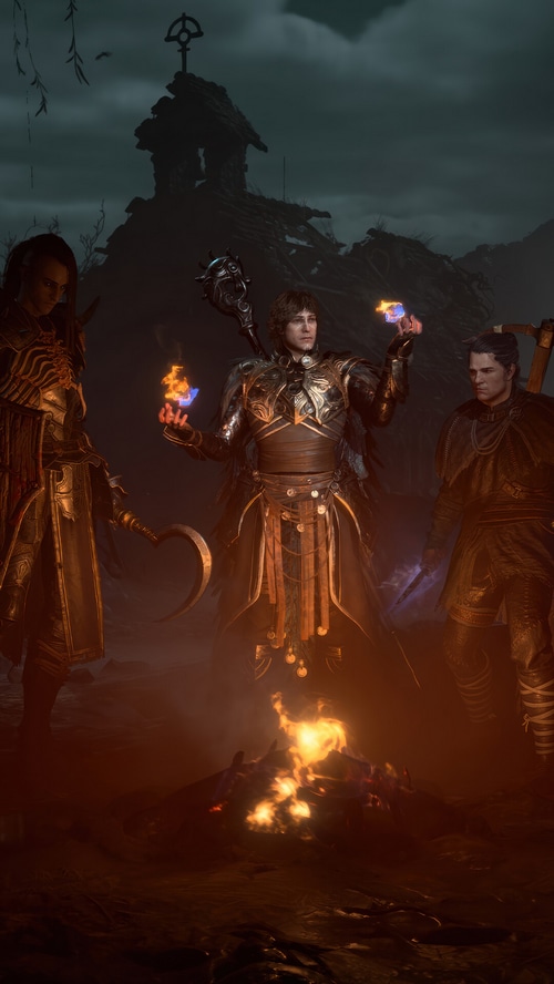 Diablo IV: Three characters gathered around a campfire