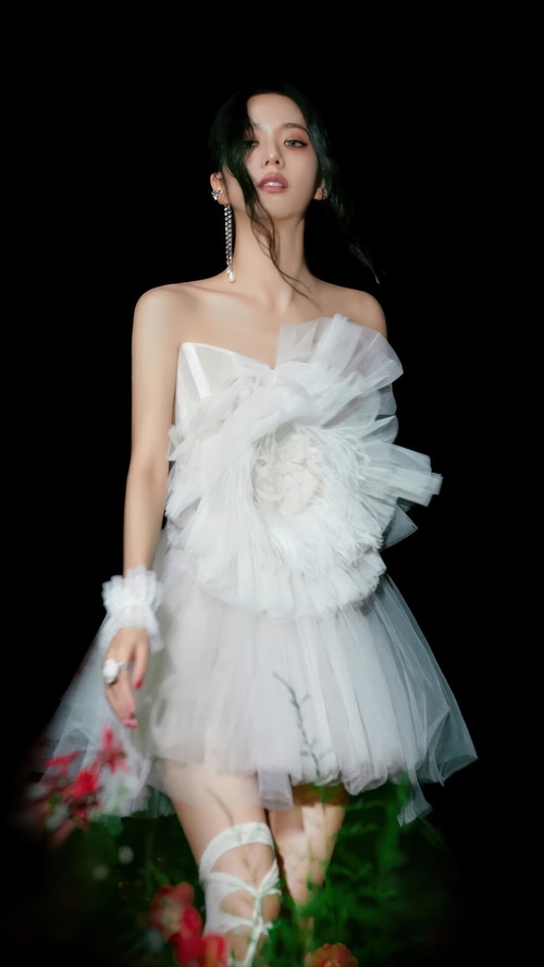Jisoo in a white strapless dress with floral accents