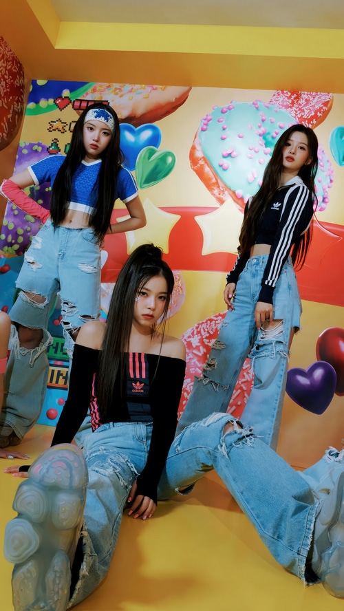 NMIXX members in colorful, donut-themed set