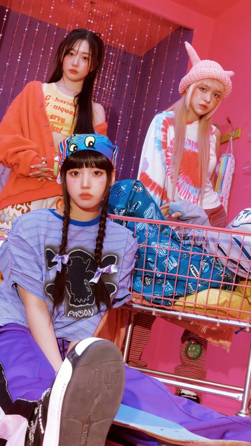 NMIXX members in colorful, playful outfits