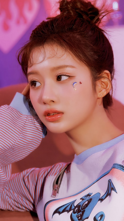 NMIXX Sullyoon with dolphin and heart face stickers
