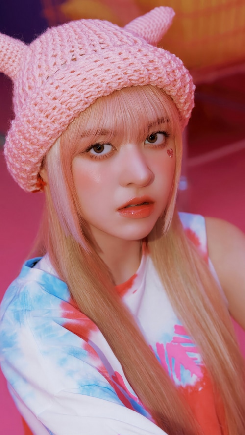NMIXX Lily wearing a pink bunny hat