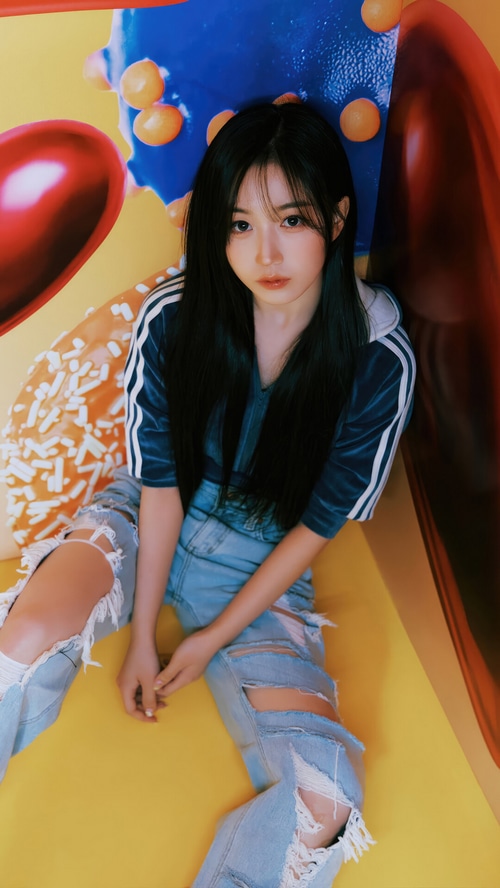 NMIXX Haewon in ripped jeans and a blue hoodie