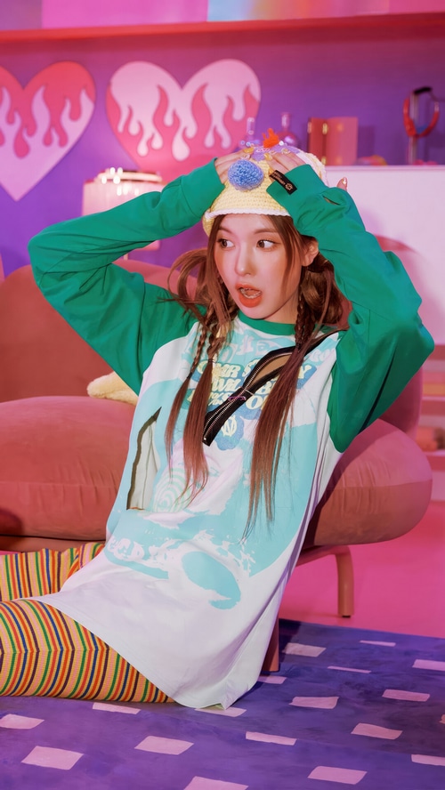 NMIXX Bae Jin Sol in a colorful, playful setting