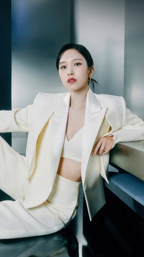 Mina from TWICE in a white suit