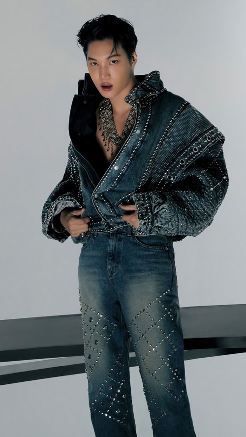 Kai in a studded denim jacket and jeans