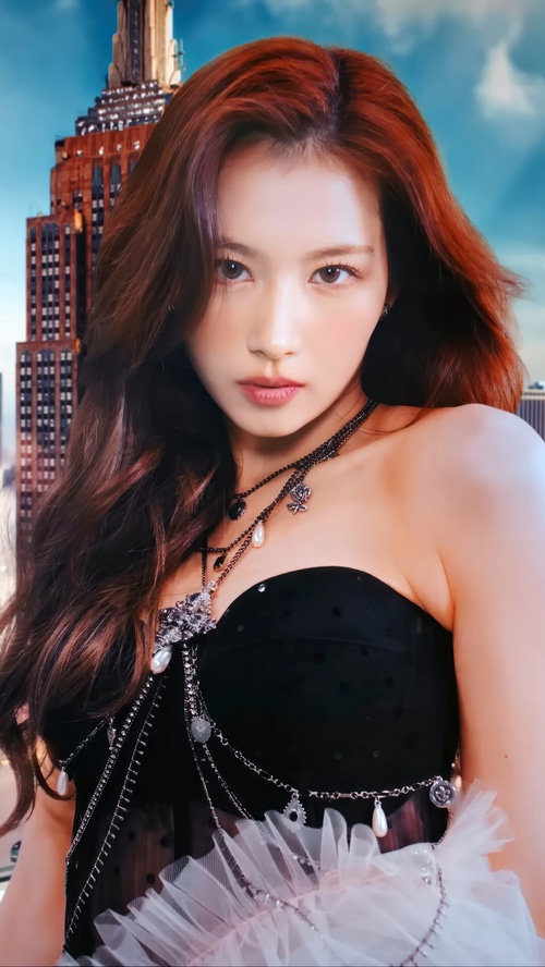 Sana from TWICE in a black dress with necklaces