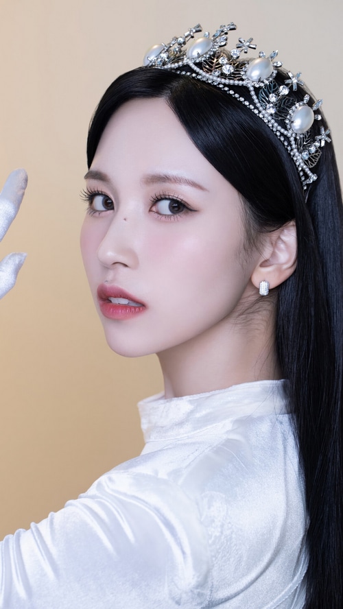 Mina wearing a tiara and white outfit