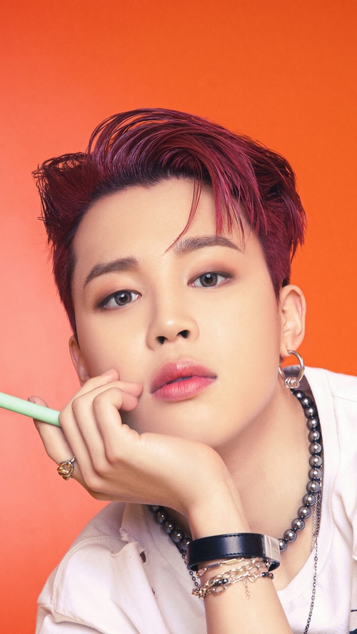 Jimin of BTS with red hair and jewelry