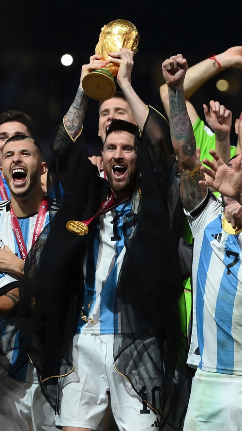 Lionel Messi lifts the FIFA World Cup trophy