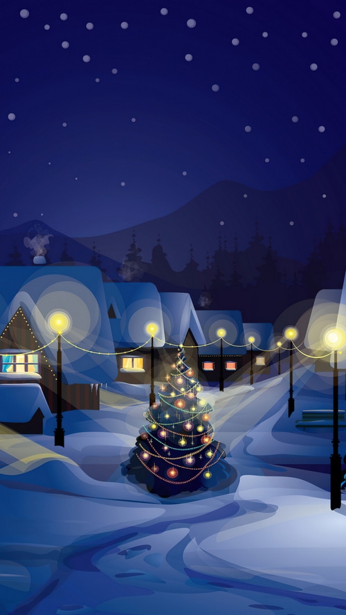 Christmas Village with Decorated Tree at Night
