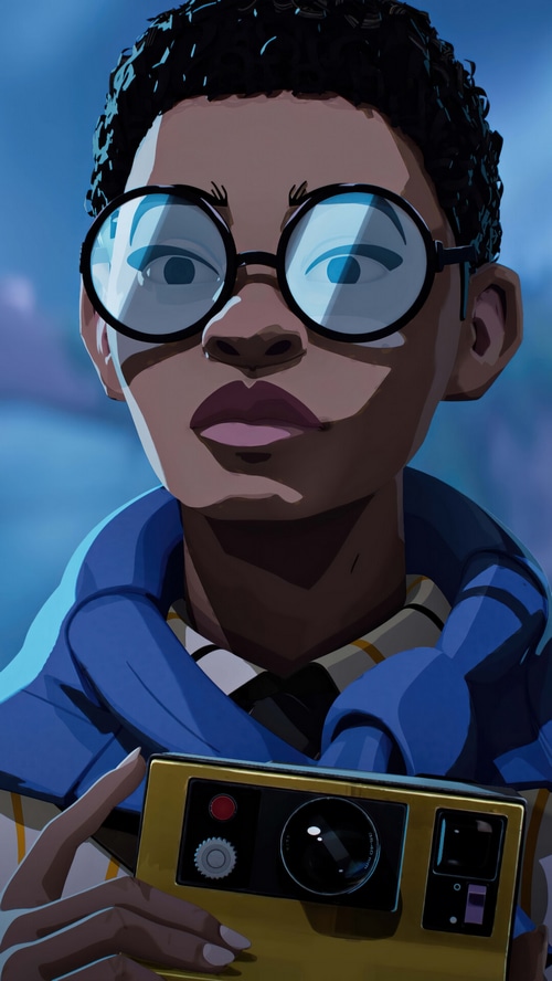 A young person with glasses holds a camera