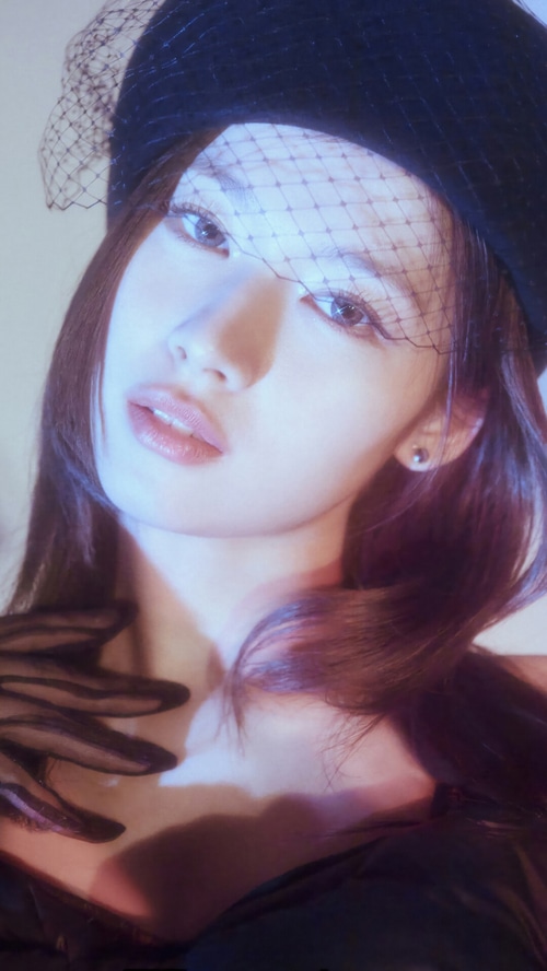 Sana from TWICE wearing a black hat and veil